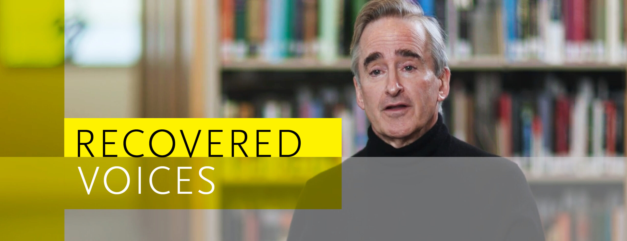 James Conlon in front of a bookshelf with Recovered Voices graphic