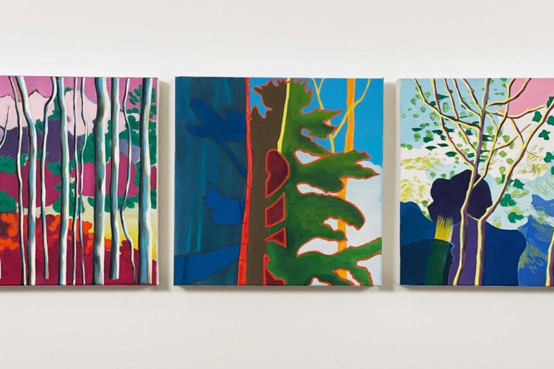 Triptych of paintings of trees next to lake
